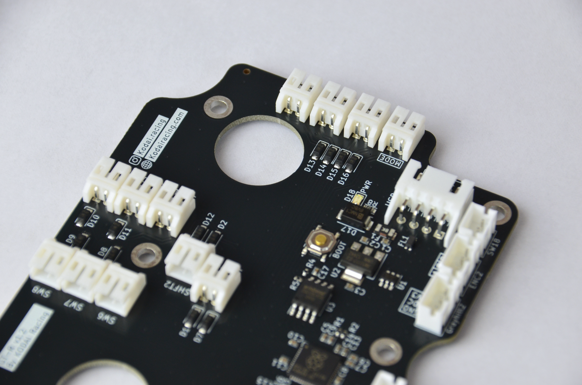 Custom PCB for GT-R DIY project with various electronic components and connection ports visible. Side view.