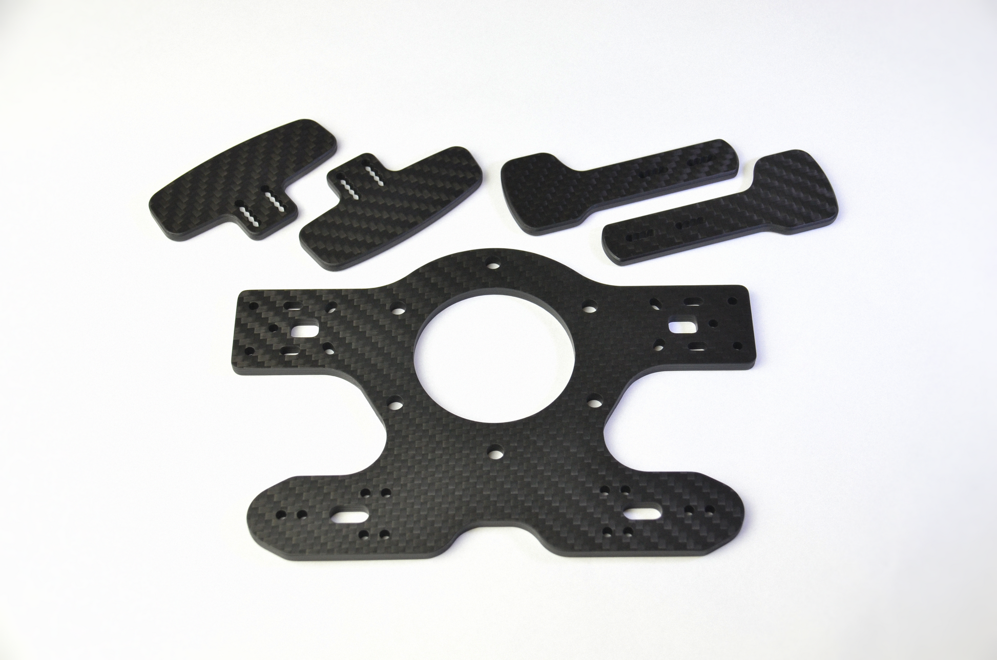 A set of black CNC carbon fibre clutch plates for the TCR3 DIY project, displayed on a white background.