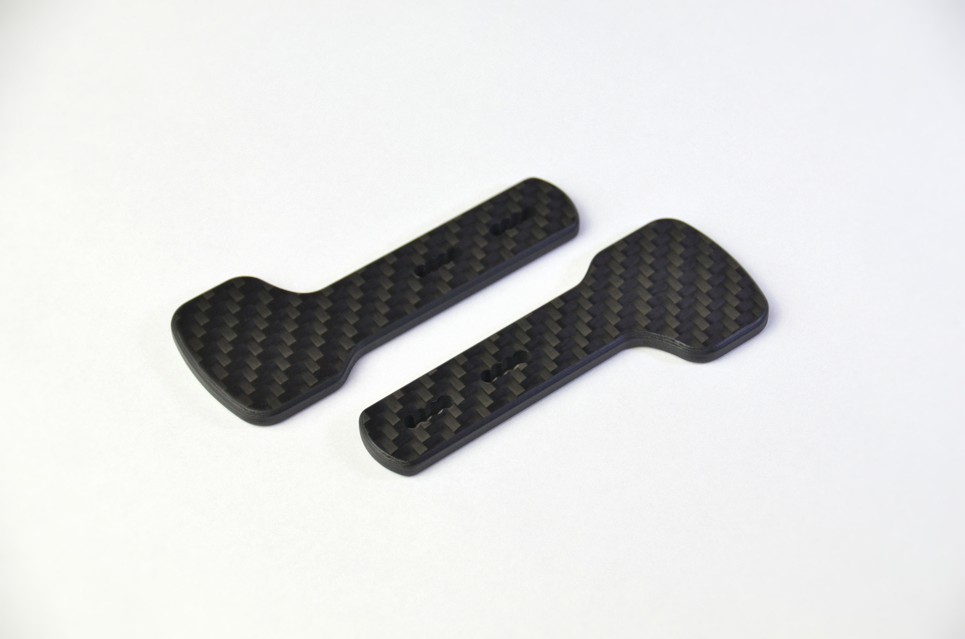 CNC-machined matte carbon fiber plates for DIY sim racing projects, lightweight and high-quality components