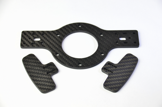 CNC carbon fibre shifter plates for TCR3, consisting of a circular plate and two rectangular paddles. Top view.