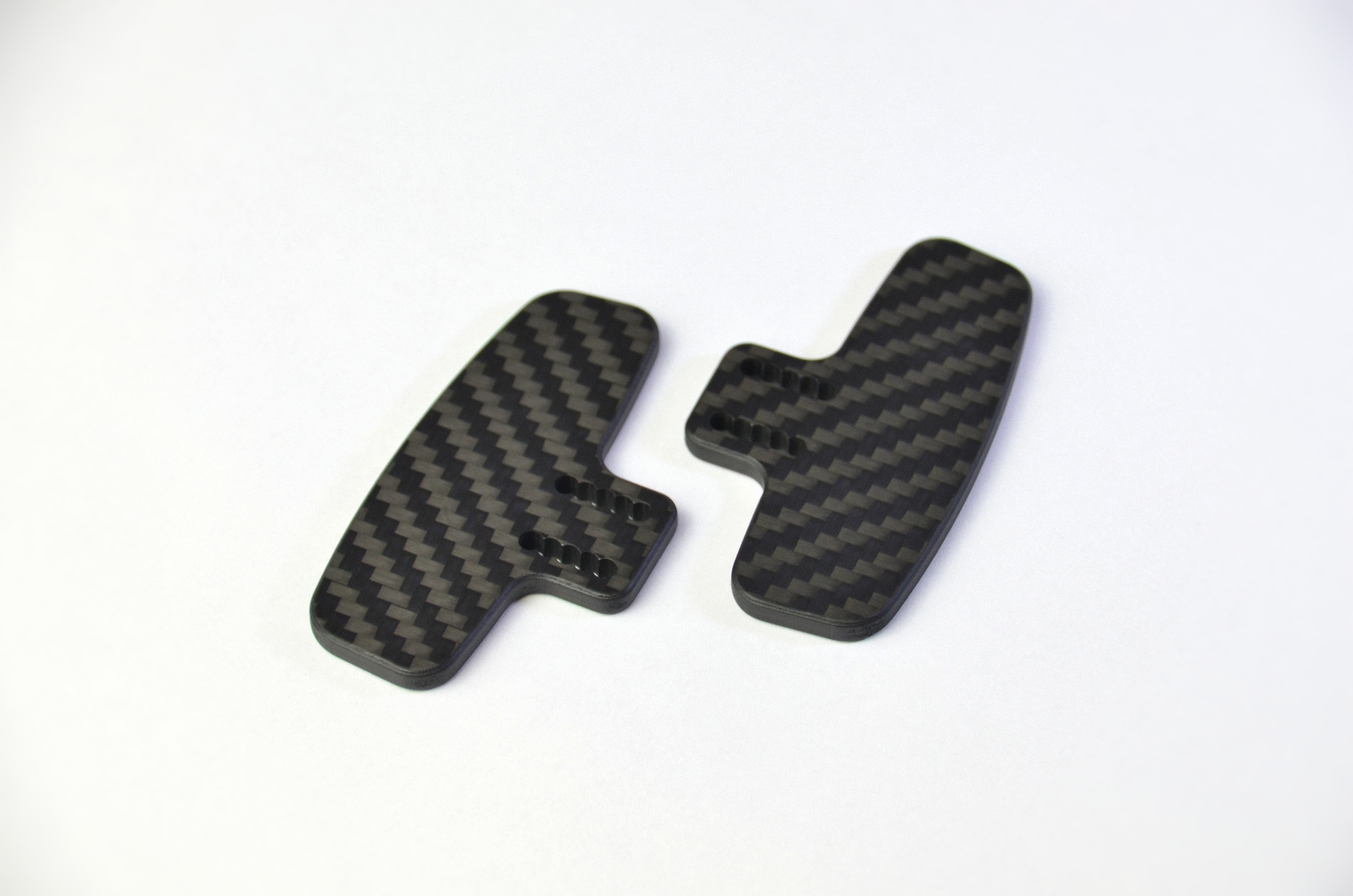 CNC-machined matte carbon fiber plates for DIY sim racing projects, lightweight and high-quality components