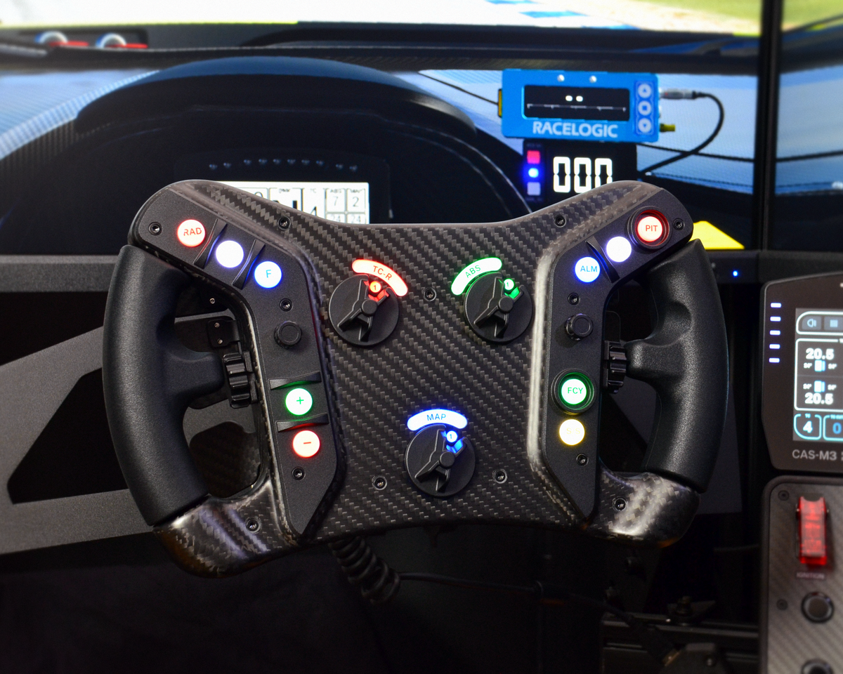 High-end AM2 GT sim racing wheel with rotary encoders, paddles, and RGB buttons. Aluminium and carbon fibre.