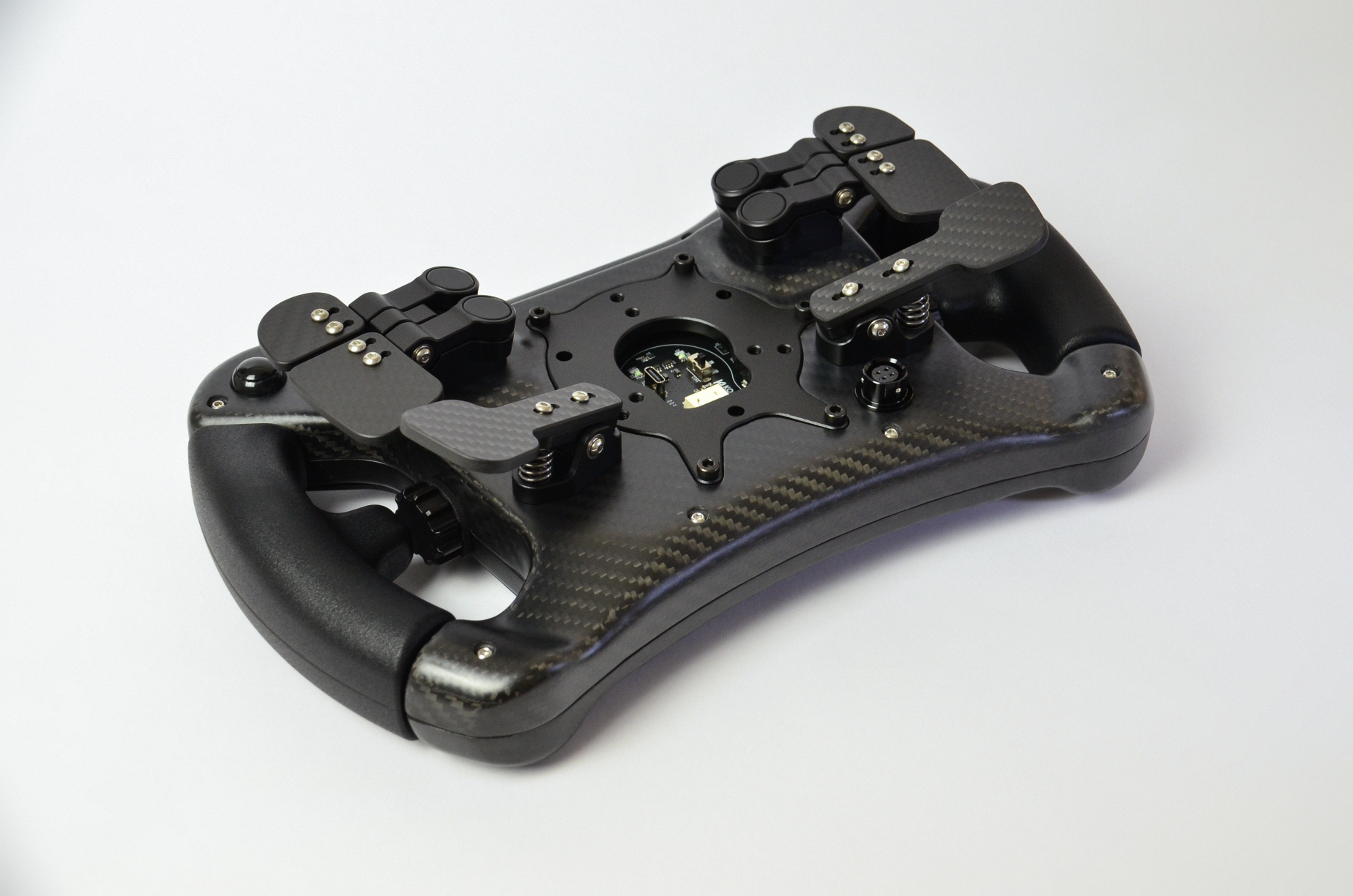 High-end AM2 GT sim racing wheel with rotary encoders, paddles, and RGB buttons. Aluminium and carbon fibre.