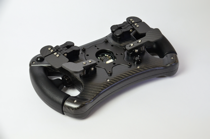 High-end AM2 GT sim racing wheel with rotary encoders, paddles, and RGB buttons. Aluminium and carbon fibre.