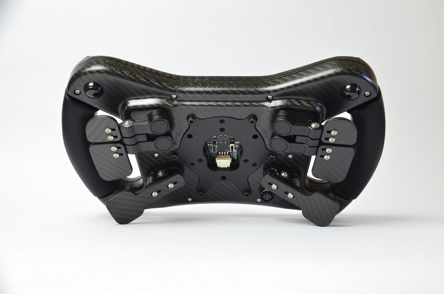 High-end AM2 GT sim racing wheel with rotary encoders, paddles, and RGB buttons. Aluminium and carbon fibre.