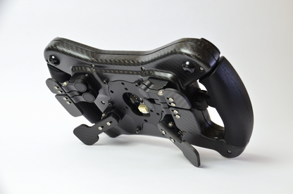 High-end AM2 GT sim racing wheel with rotary encoders, paddles, and RGB buttons. Aluminium and carbon fibre.