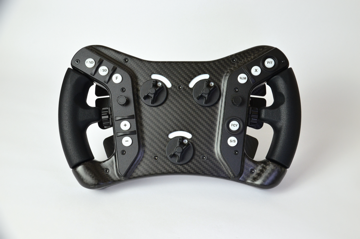 High-end AM2 GT sim racing wheel with rotary encoders, paddles, and RGB buttons. Aluminium and carbon fibre.