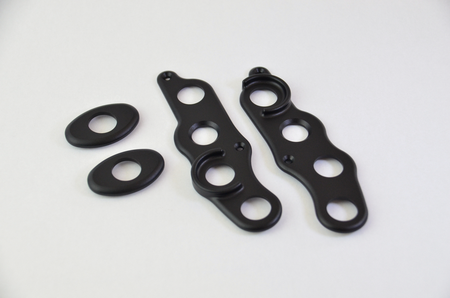 CNC machined aluminium button surrounds with a black anodized finish, designed for the MF1 DIY sim racing wheel.